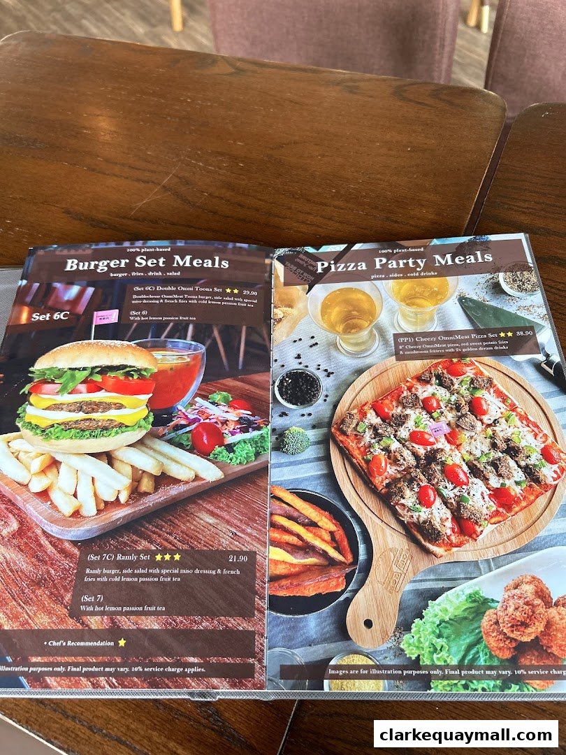A menu featuring plant-based burger and pizza meal sets with accompanying sides and drinks.