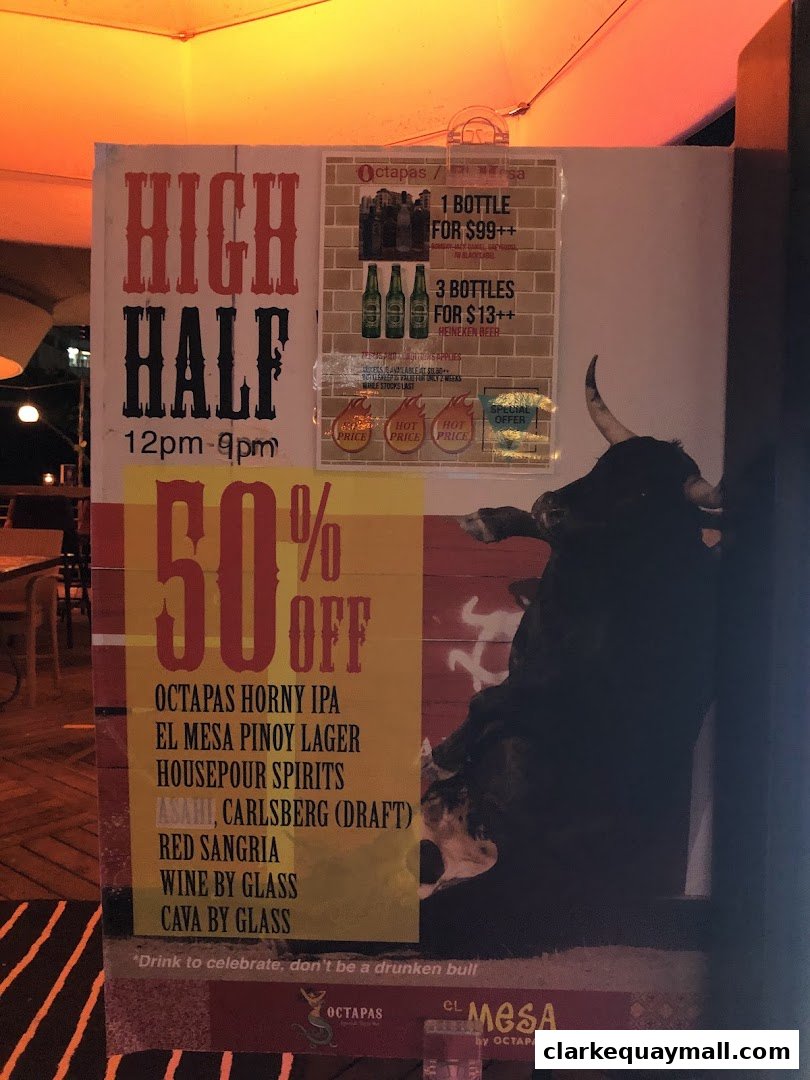 A sign advertising happy hour and discounts at Octapas, featuring a bull graphic.