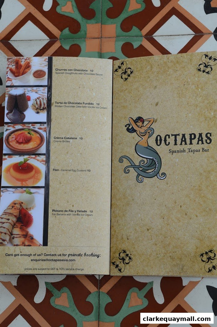 A menu from Octapas Spanish Tapas Bar featuring desserts with images and prices.