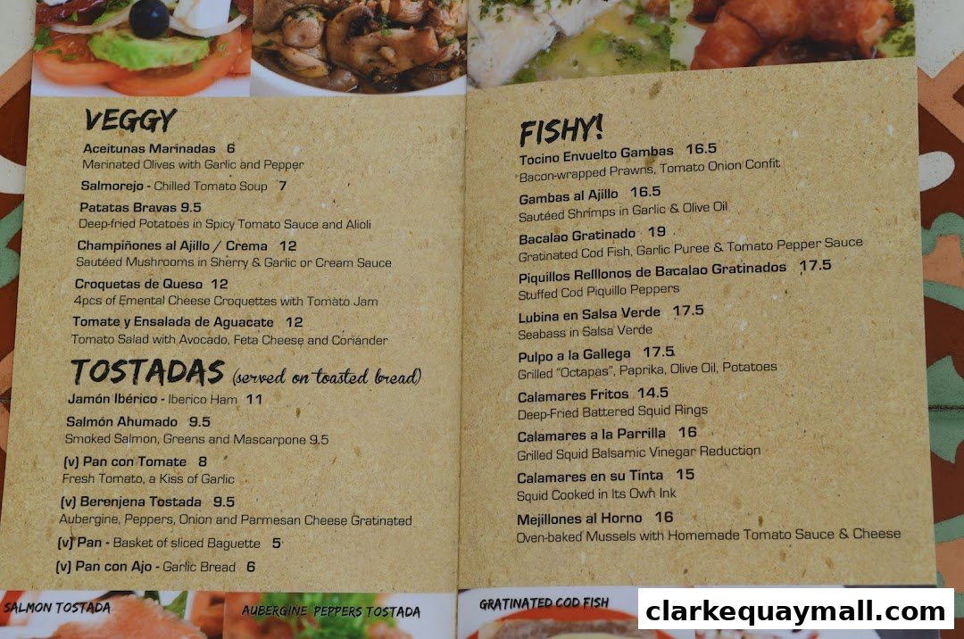 A menu from Octapas featuring Veggy and Fishy tapas, with descriptions and prices.