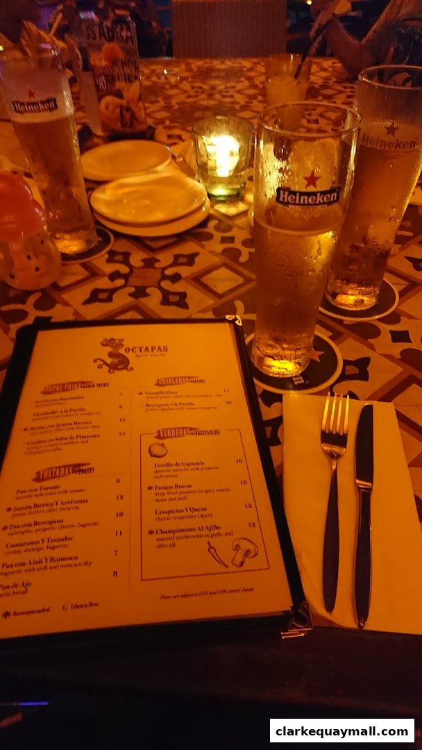 A menu from Octapas International Tapas Bar with drinks and tapas listed.