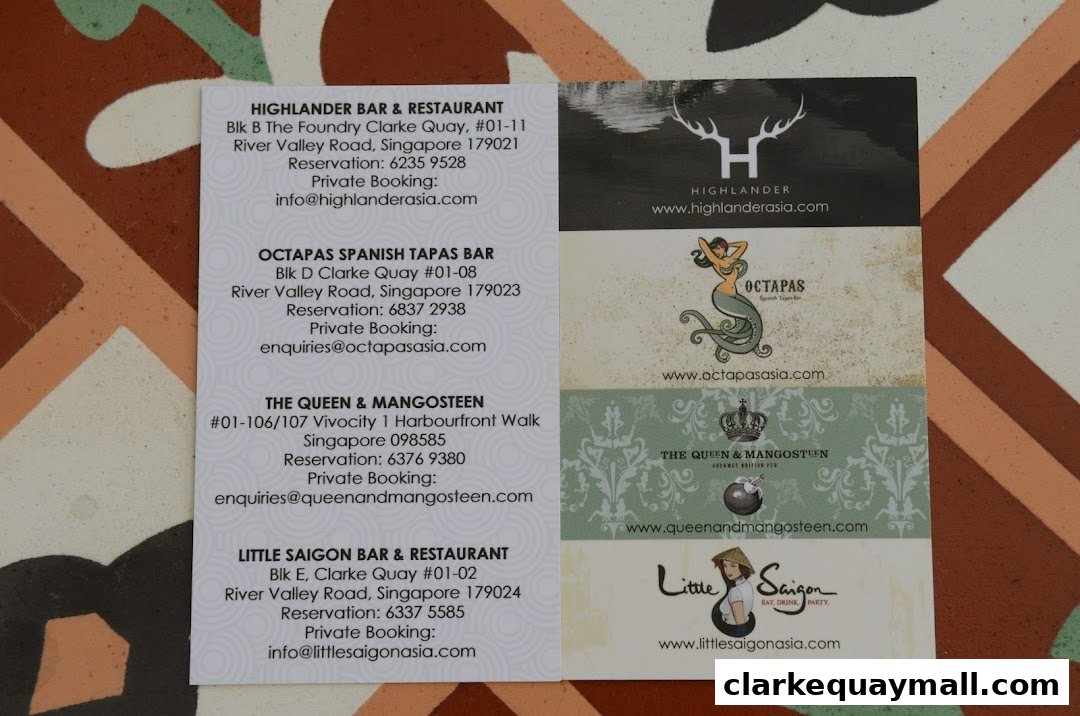 A collection of business cards for various restaurants and bars, including Octapas Spanish Tapas Bar.