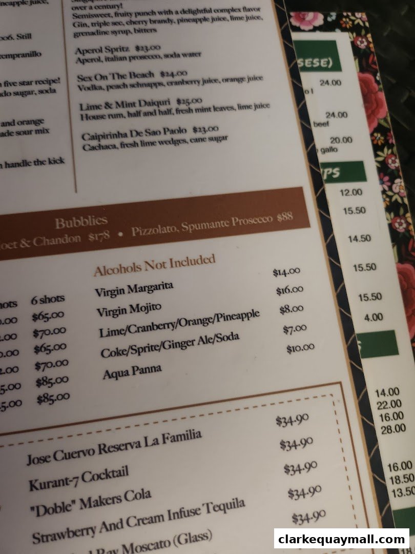 A close-up view of a menu at Octapas, featuring cocktails and other beverages.