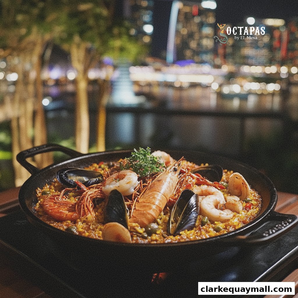 A delicious seafood paella served in a pan with a city skyline at night in the background.