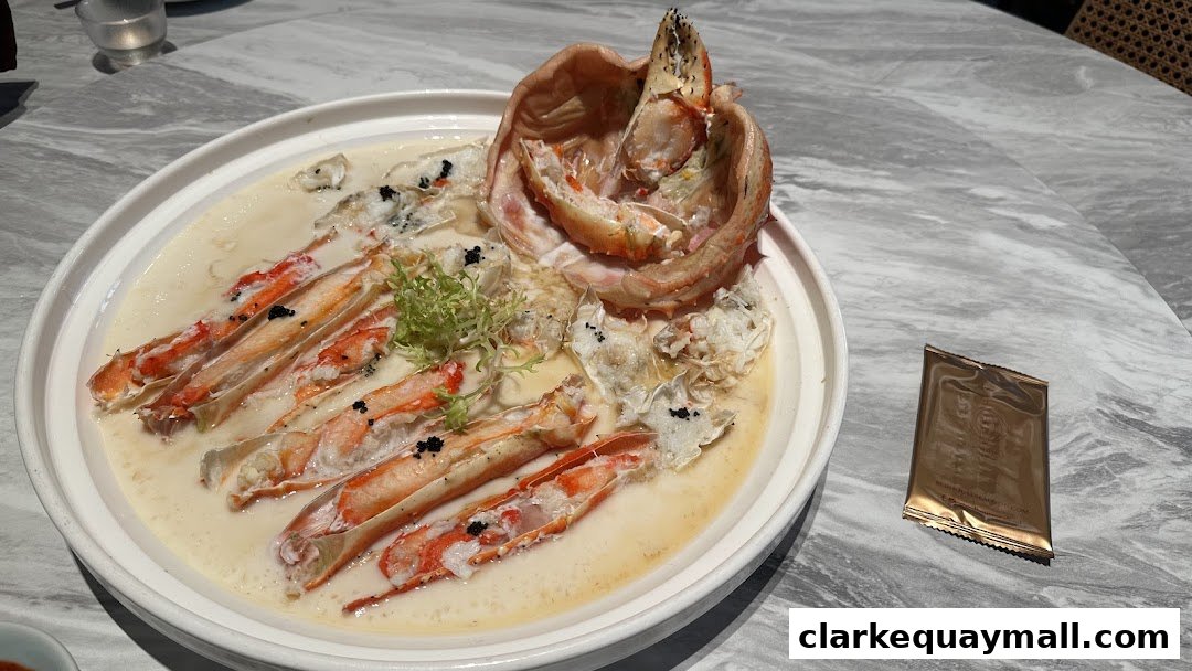 A close-up of a seafood dish with crab legs in a creamy sauce, garnished with caviar.