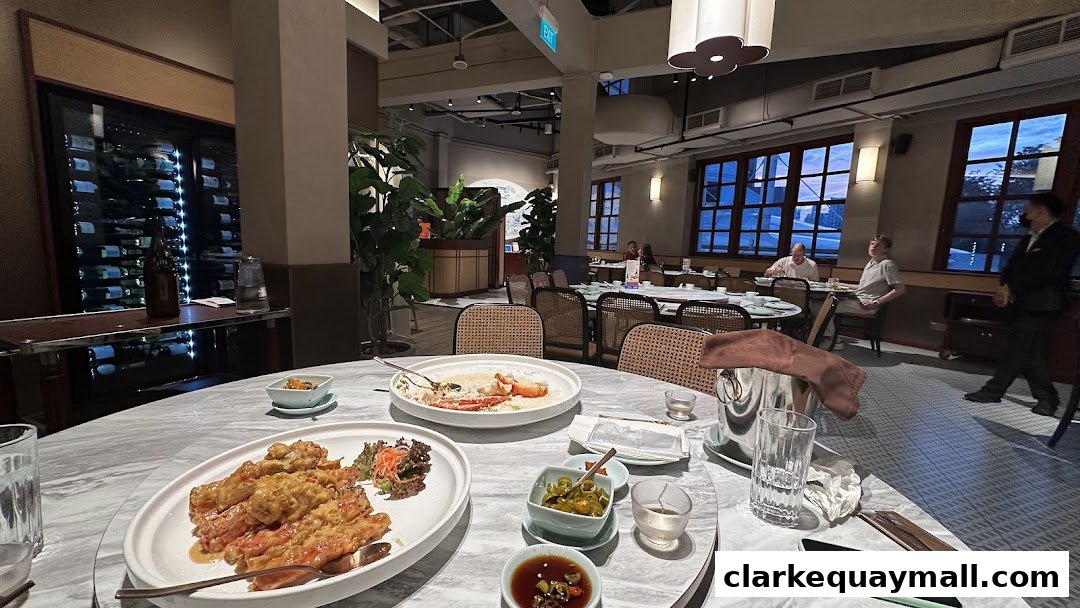 A table setting at Red House Seafood Nanyang Clarke Quay with dishes and drinks.