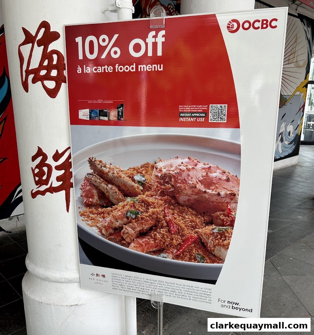 A sign advertising 10% off at Red House Seafood with a picture of a crab dish.