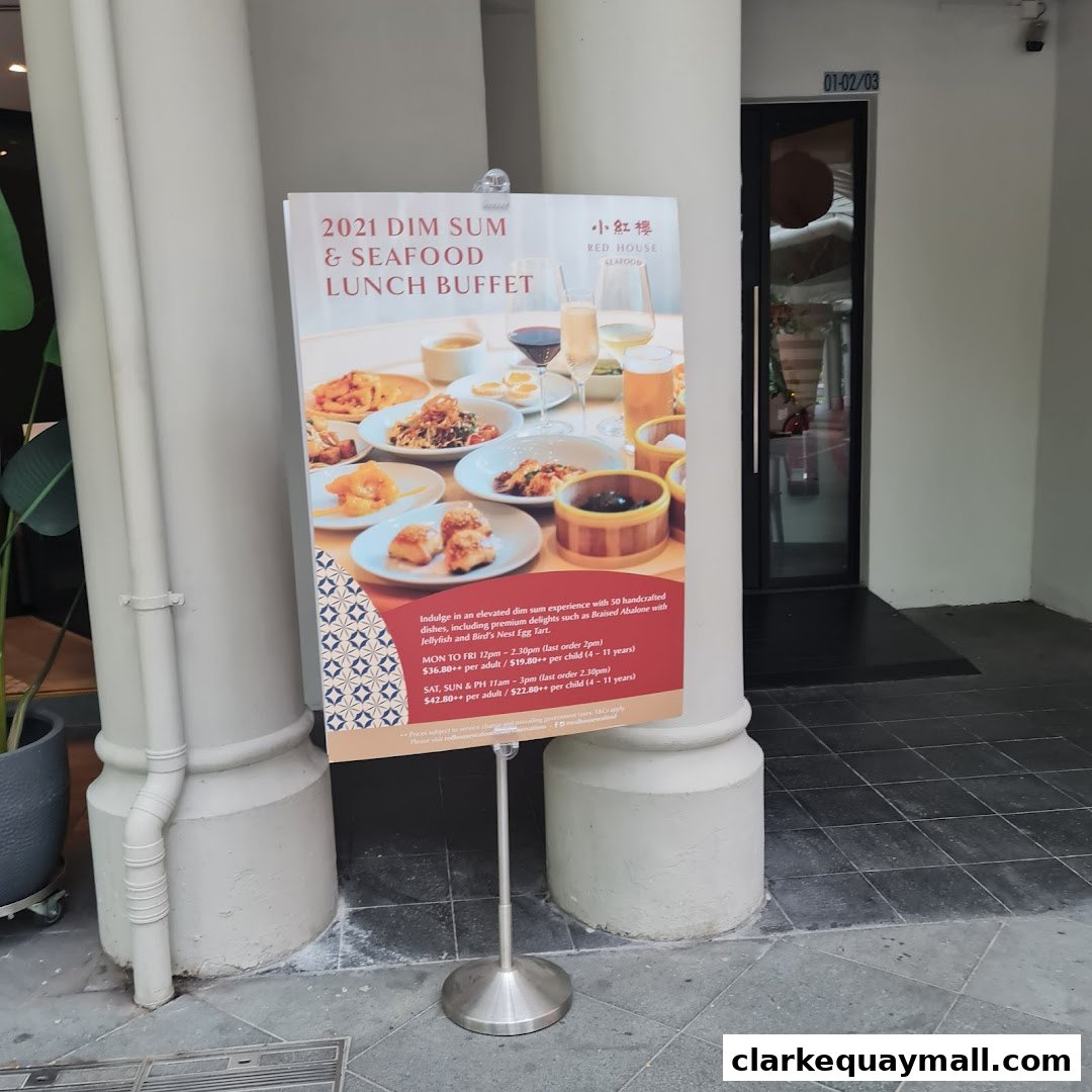 A sign advertising a dim sum and seafood lunch buffet at Red House Seafood.