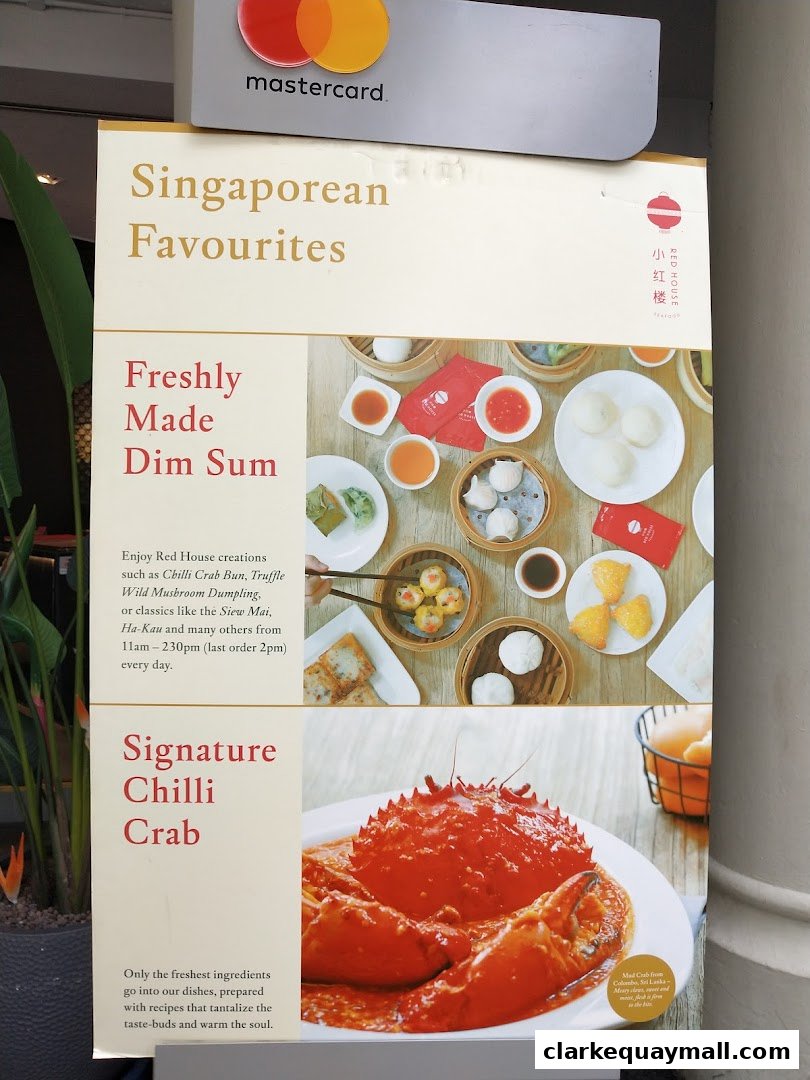 A sign advertising Singaporean favourites, featuring Dim Sum and Chilli Crab.