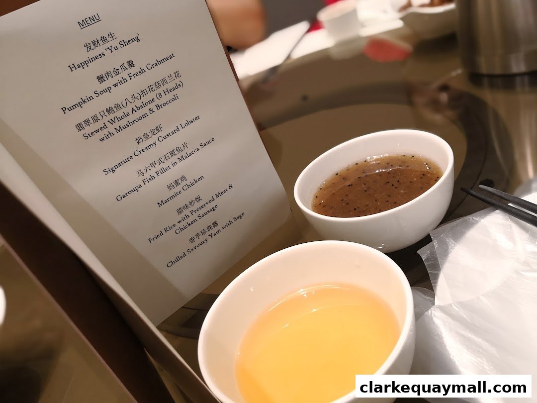 A menu from Red House Seafood Nanyang Clarke Quay with various seafood dishes listed.