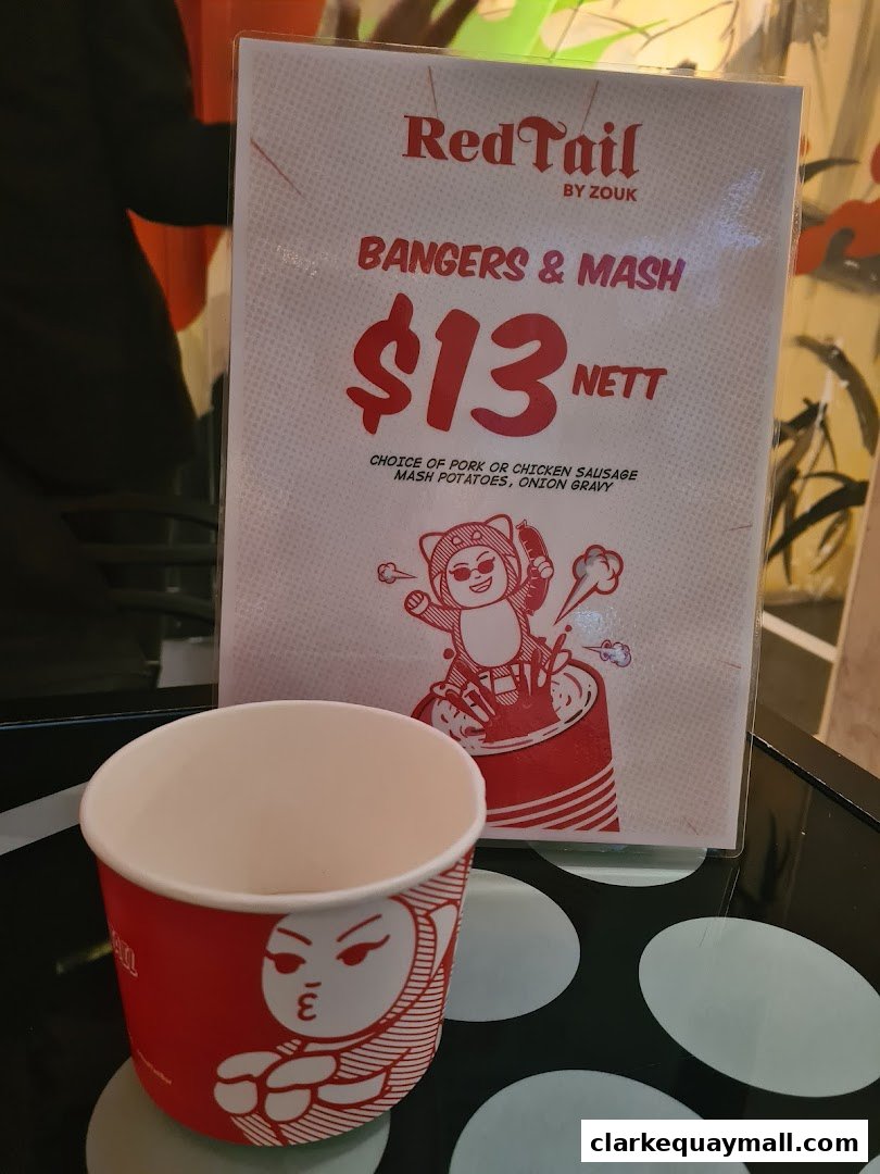 A menu item for Bangers & Mash at RedTail Bar By Zouk with a price and description.