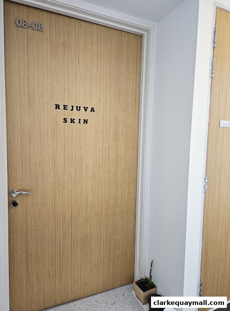 A wooden door with the name 'Rejuva Skin' and room number '08-08' above it.