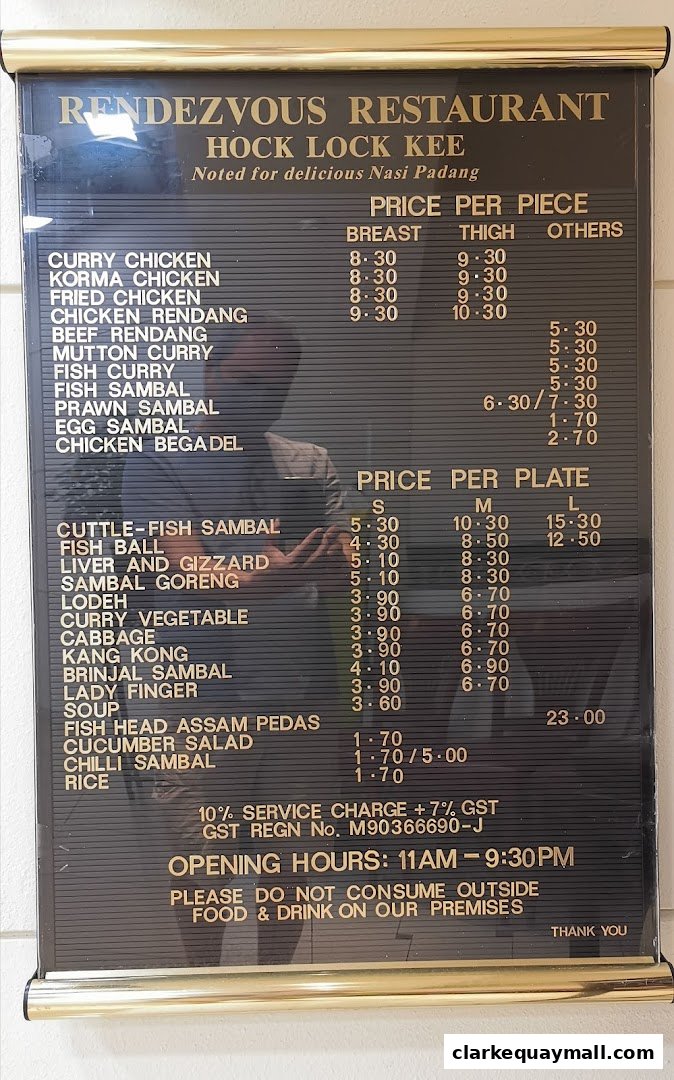 A menu board for Rendezvous Restaurant Hock Lock Kee, featuring prices for various dishes.