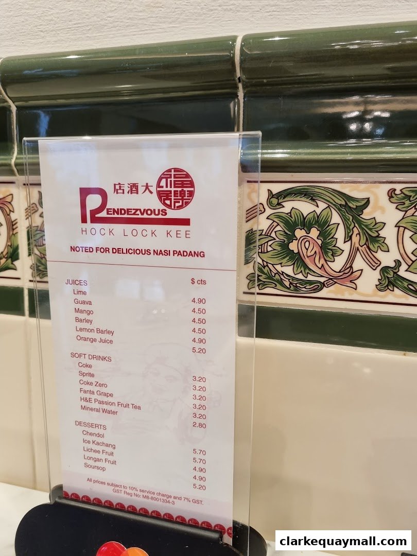 A menu from Rendezvous Restaurant Hock Lock Kee, featuring juices, soft drinks, and desserts.