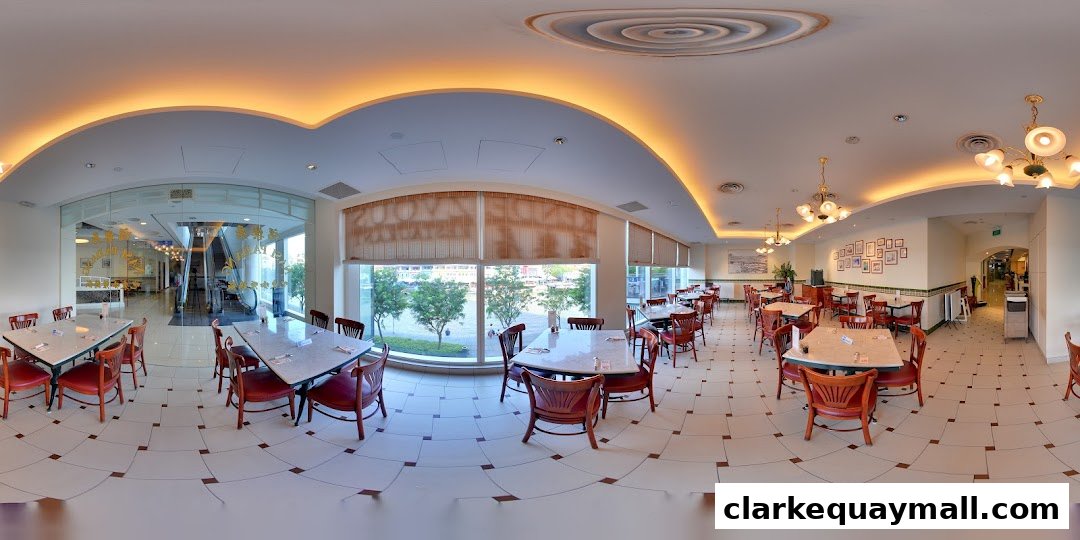 Interior view of Rendezvous Restaurant Hock Lock Kee with tables and chairs.