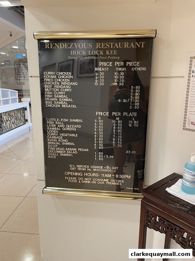 A menu board for Rendezvous Restaurant Hock Lock Kee, featuring prices for various dishes.