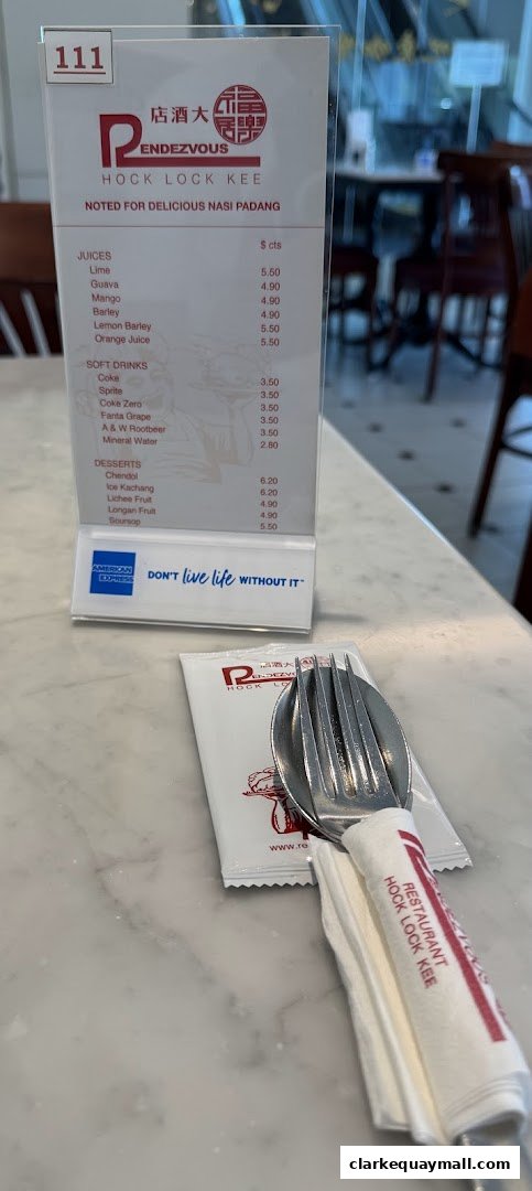 A menu from Rendezvous Restaurant Hock Lock Kee, featuring juices, soft drinks, and desserts.