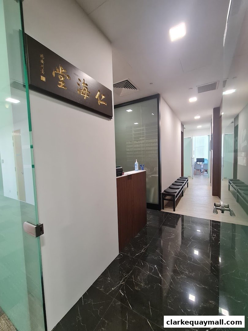 Interior hallway of Renhai Clinic with a reception desk and waiting area.