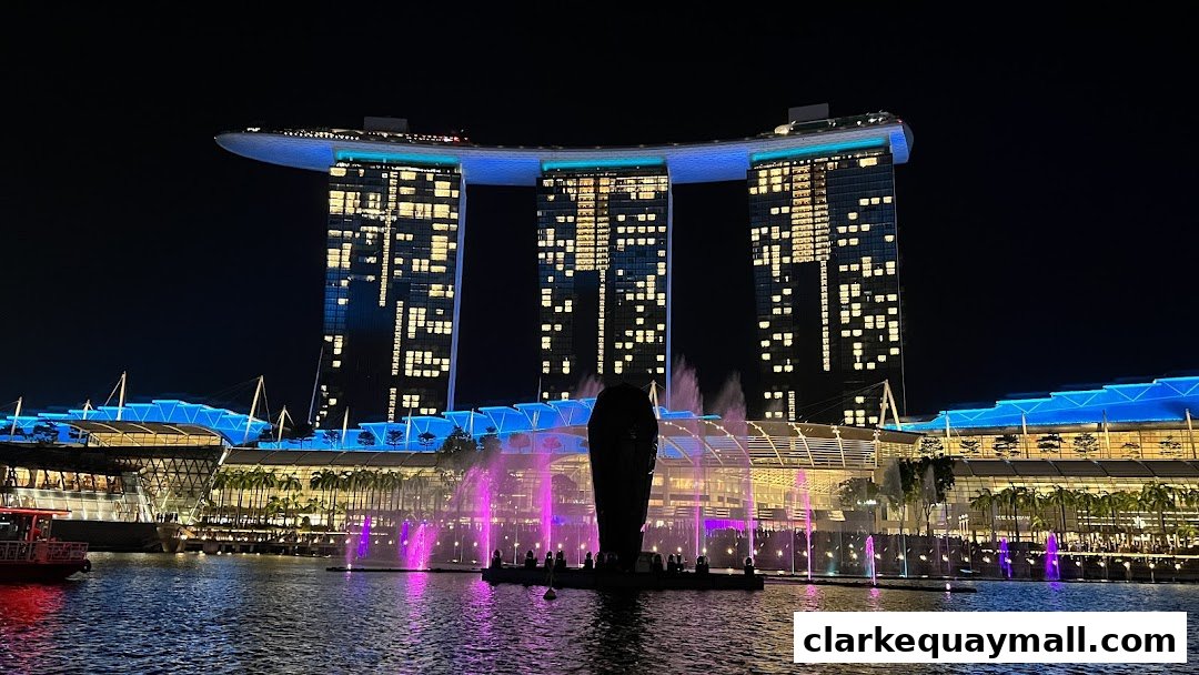 Night view of Marina Bay Sands with a light and water show.