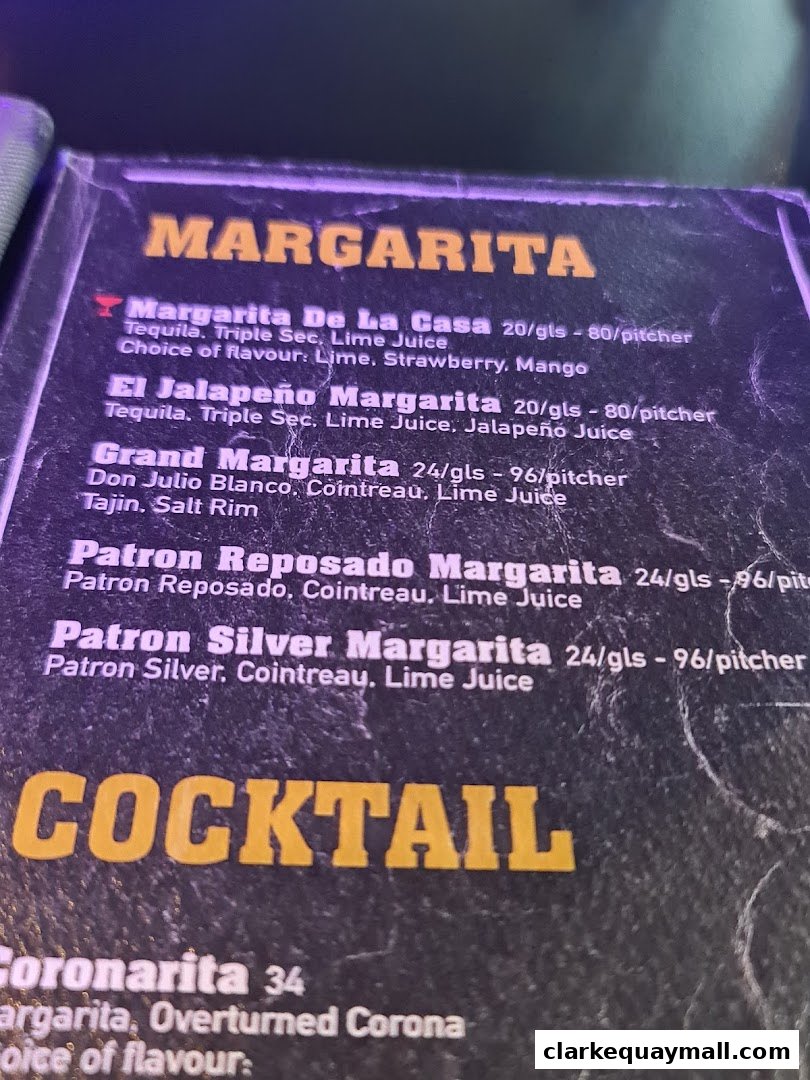 A menu featuring various margaritas and cocktails with prices.