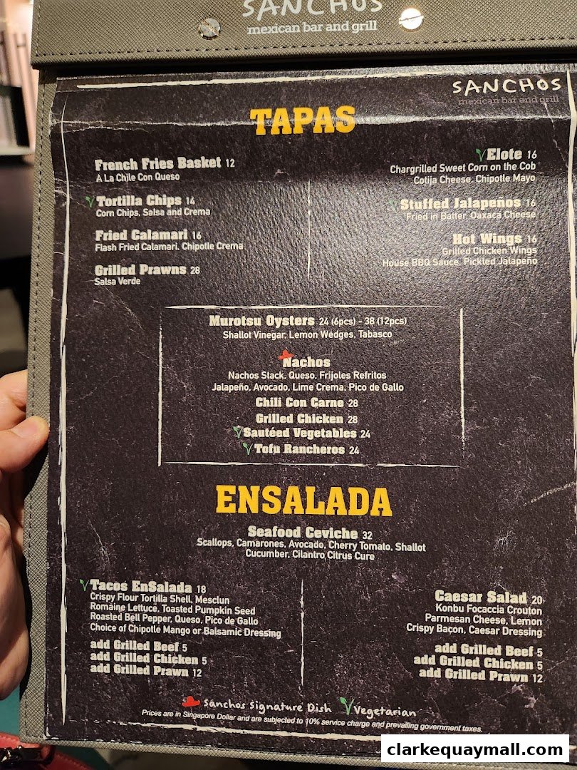 A menu from Sancho's Mexican Bar and Grill featuring tapas, ensaladas, and other dishes.