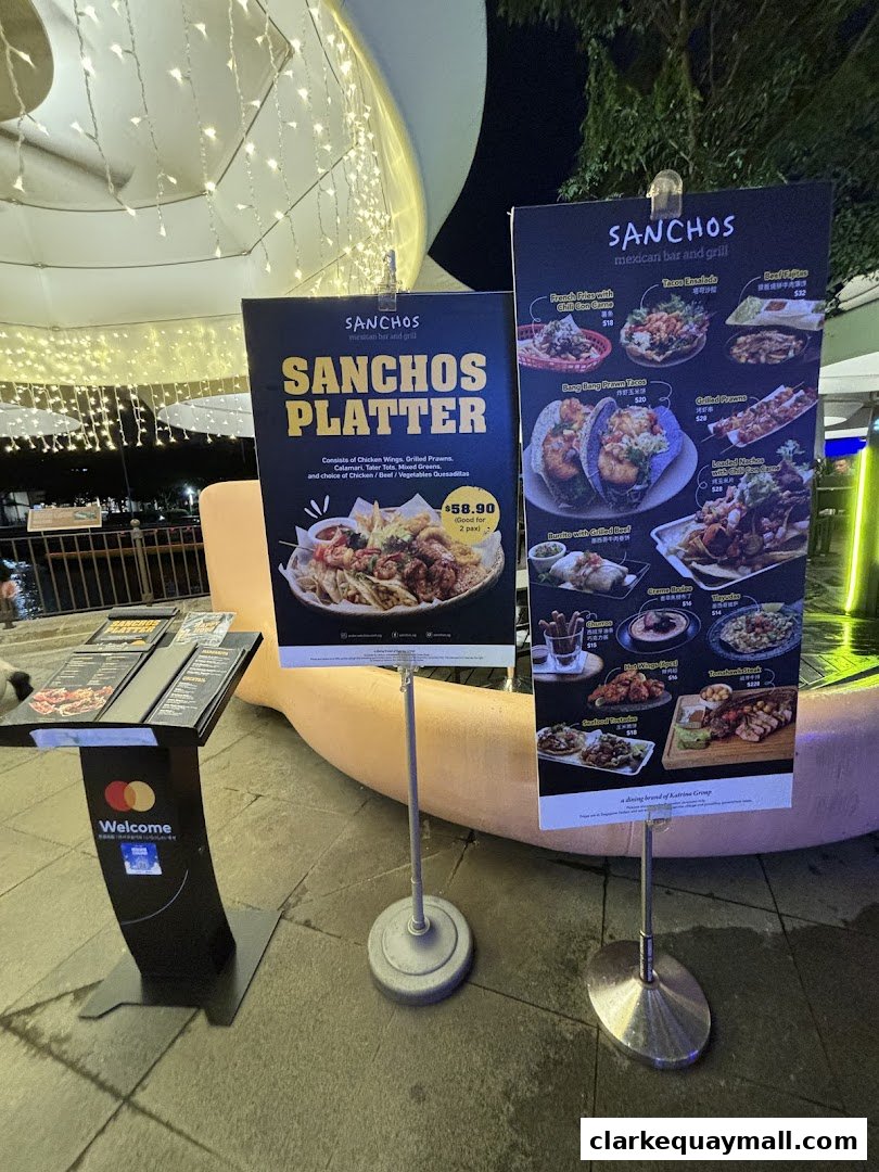 Two display boards showcasing Sanchos Mexican Bar and Grill's platters and menu items.