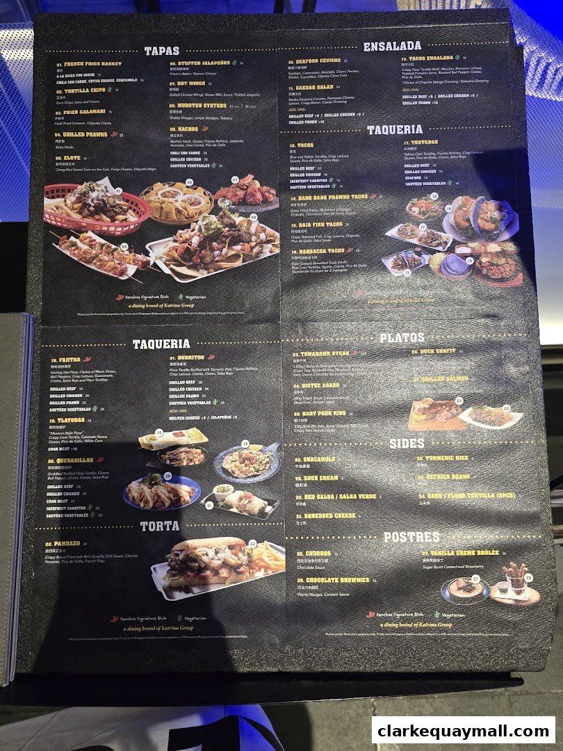 A menu from Rico Rico Clarke Quay featuring tapas, ensalada, taqueria, platos, sides, and postres.