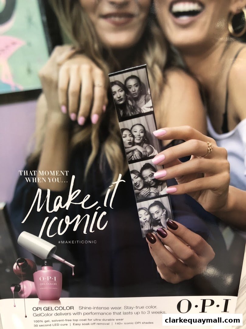 Two women with manicured nails holding a photo strip, promoting OPI GelColor.