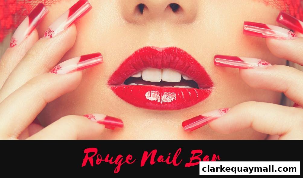 Close-up of a woman's lips and hands with striking red nails and lipstick.