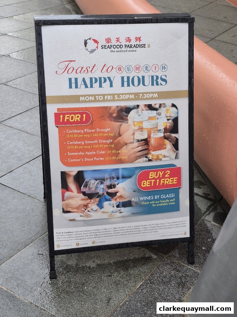 A sign advertising happy hour deals for Seafood Paradise, featuring 1-for-1 beers and buy 2 get 1 free wines.