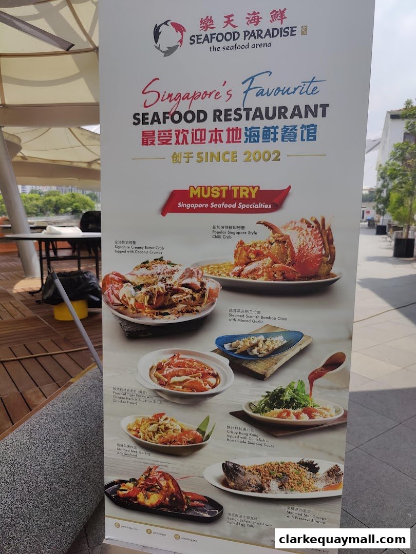 A menu board showcasing various seafood dishes offered by Seafood Paradise.