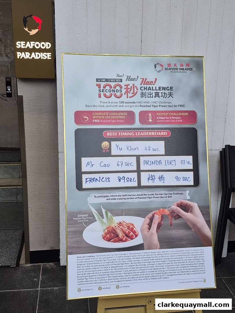 A promotional poster for a 100-second challenge at Seafood Paradise, featuring a leaderboard and a dish of prawns.