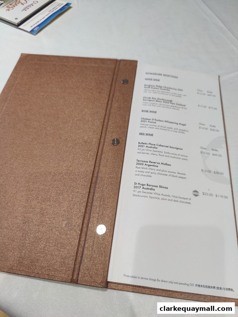 A wine menu from Seafood Paradise, featuring white, rose, and red wine selections with prices.