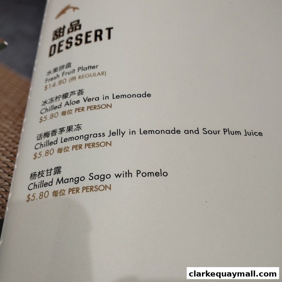 A menu page from Seafood Paradise featuring desserts like fruit platter and aloe vera.