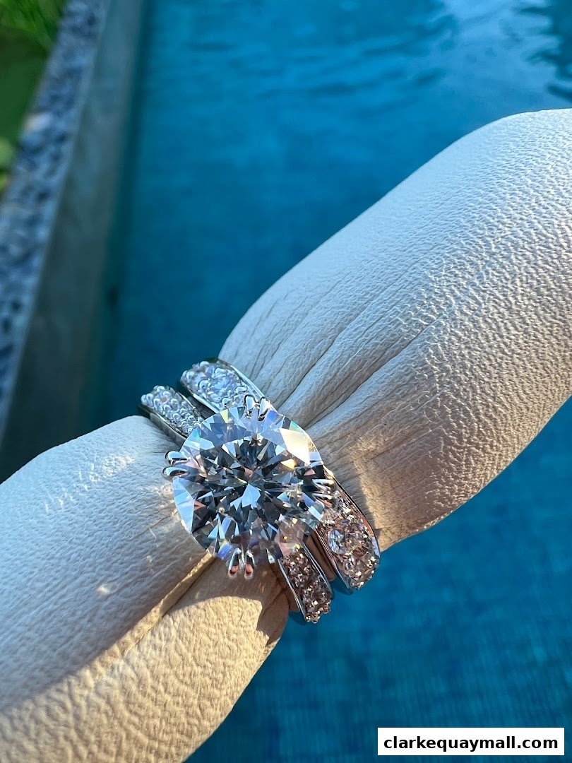 A close-up of a stunning diamond engagement ring and wedding band set.