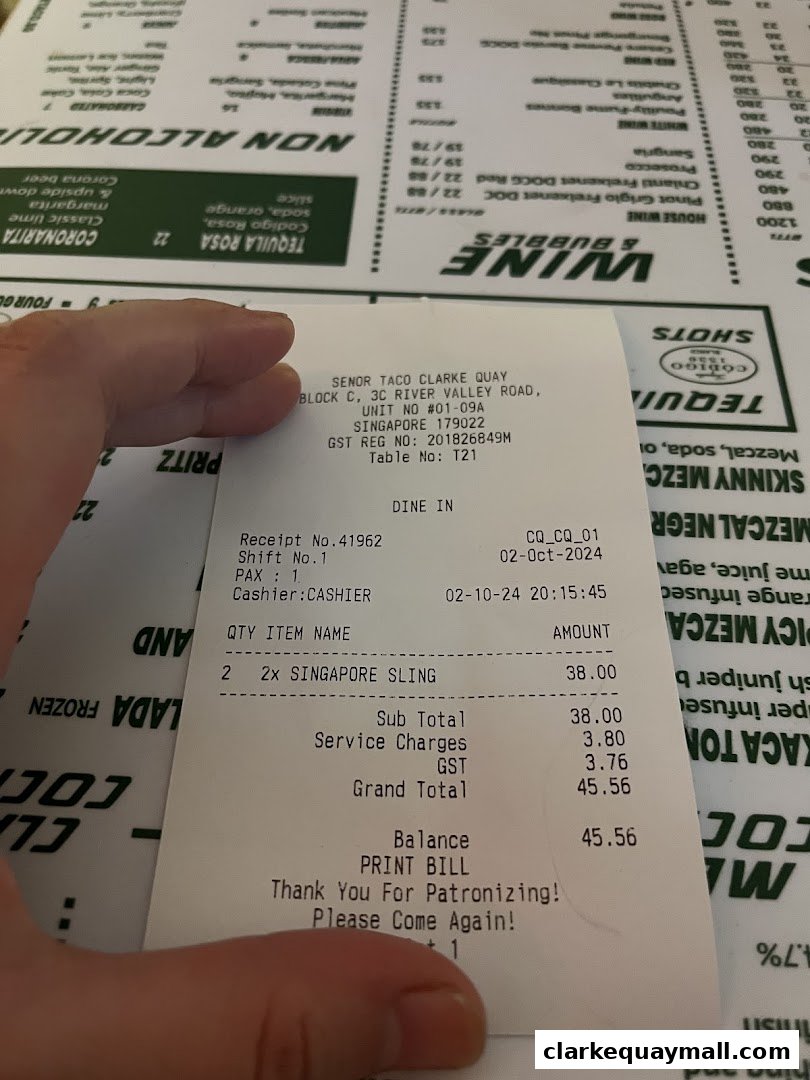 A receipt from Señor Taco Clarke Quay showing a purchase of two Singapore Slings.