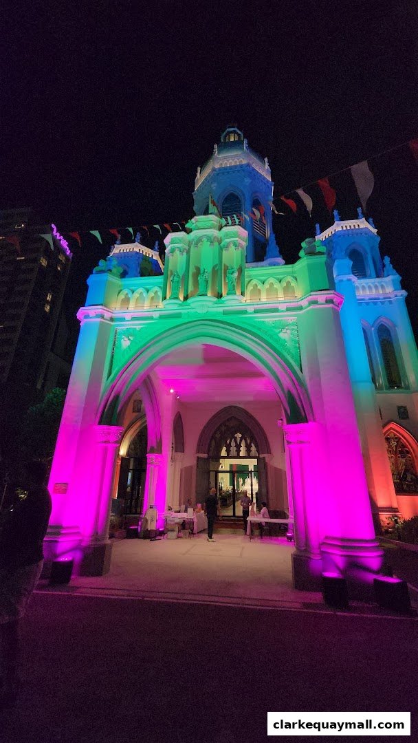 A building with colorful lights and flags, suggesting a festive event or shop.