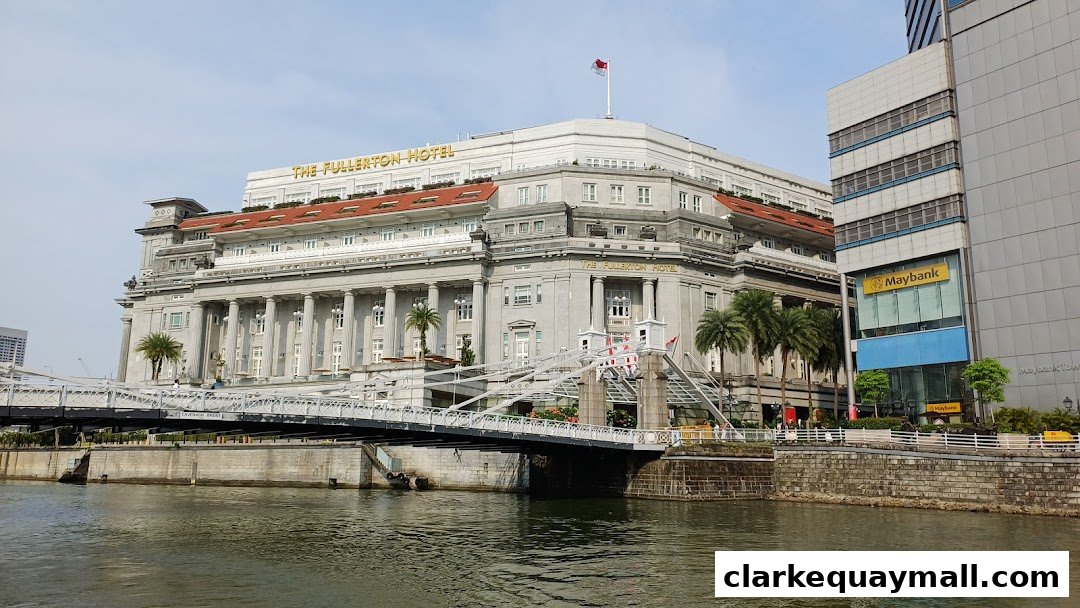 The Fullerton Hotel and Cavenagh Bridge over the Singapore River.