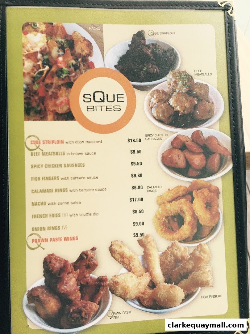A menu from SQUE Bites featuring various appetizers like nachos, meatballs, and fried items.