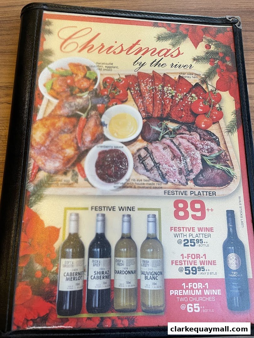 A menu featuring a festive platter and wine specials for Christmas.
