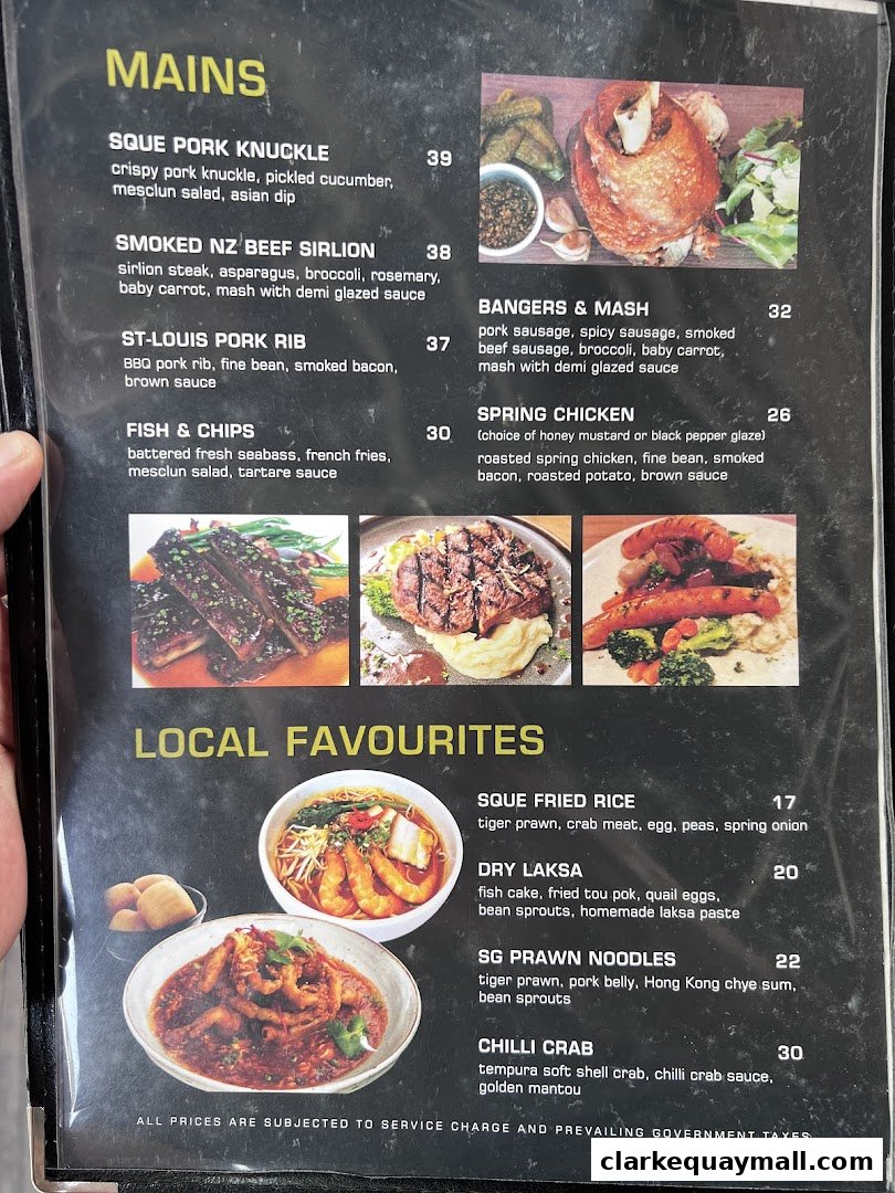 A menu from SQUE Rotisserie & Alehouse featuring mains and local favorites.