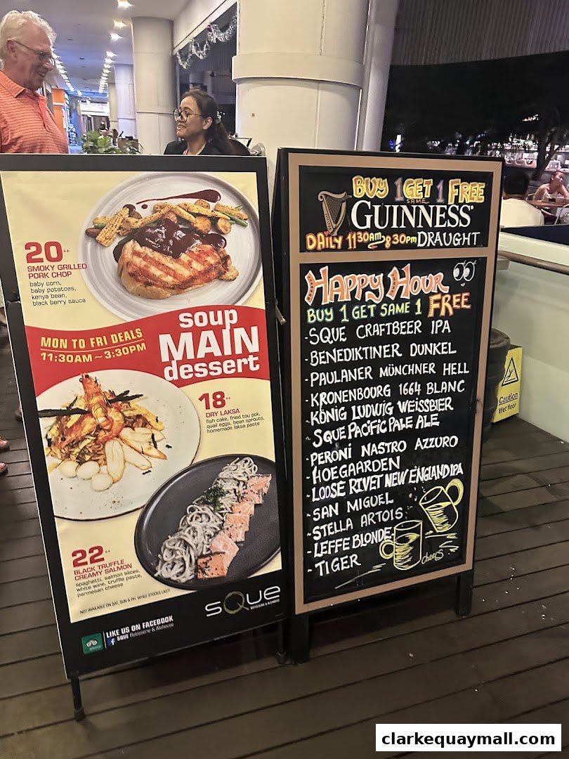 A shop front display with food and drink specials, including Guinness and craft beer offers.