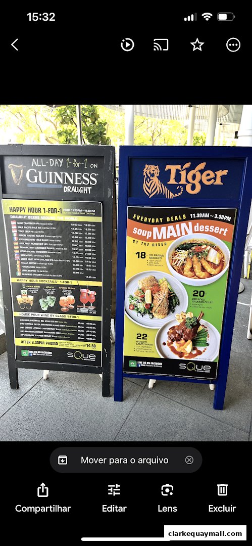 A-frame signs advertising Guinness draught, happy hour deals, and everyday soup, main, and dessert specials.