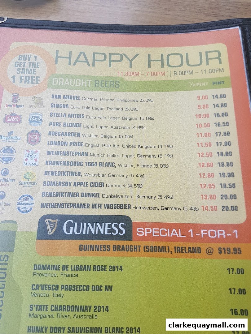 A menu featuring happy hour specials, draught beers, wines, and a Guinness promotion.