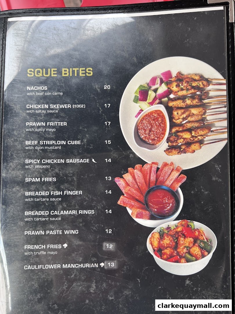 A menu page from SQUE Rotisserie & Alehouse featuring various appetizers and sides.