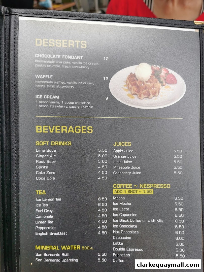 A menu featuring desserts and beverages, including coffee, tea, soft drinks, and juices.