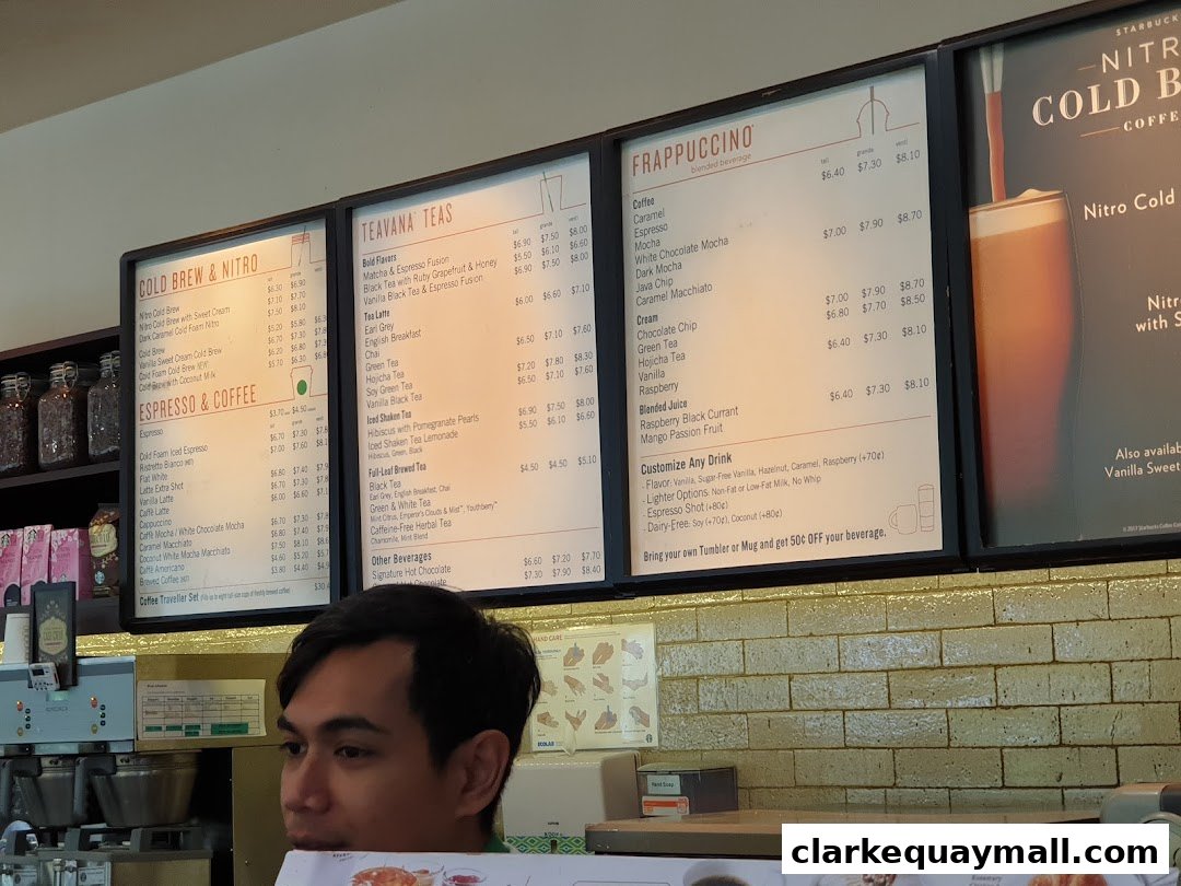 A menu board displaying various Starbucks drinks including Cold Brew, Teavana Teas, and Frappuccinos.