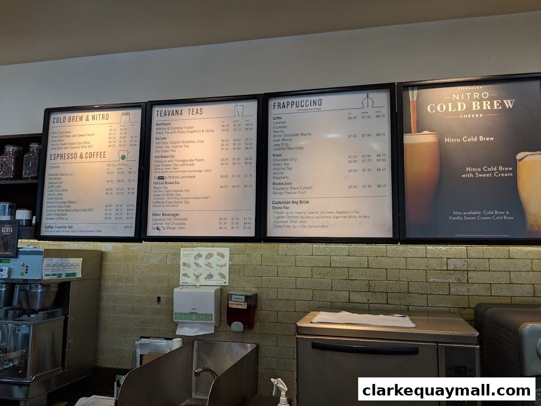 A menu board displaying various Starbucks coffee, tea, and Frappuccino drinks with prices.