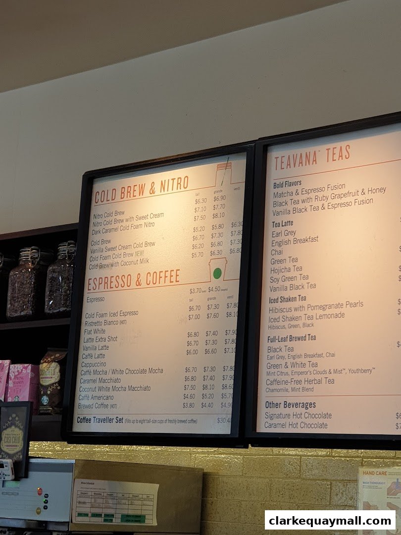 A menu board displaying various coffee and tea options at Starbucks.