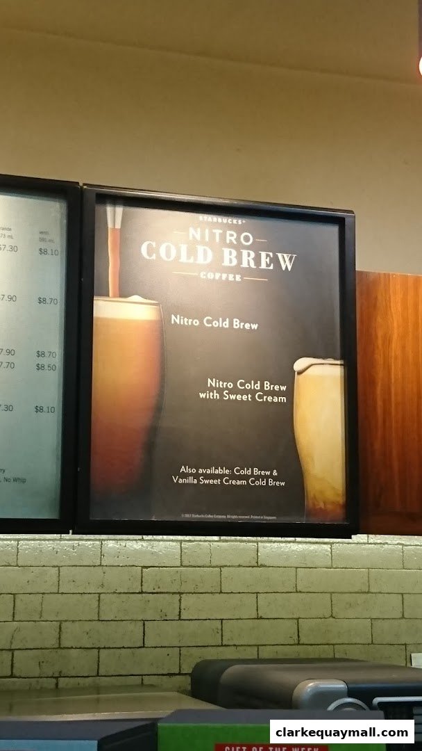 A sign advertising Starbucks Nitro Cold Brew coffee with sweet cream.